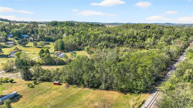 a view of a garden with a building in the background