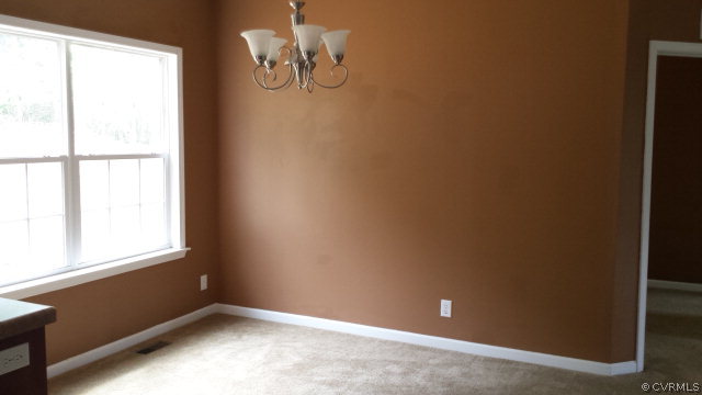 3814 Meherrin Road Meherrin, VA 23954 - Photo 3 of 15 a view of room with window and ceiling fan