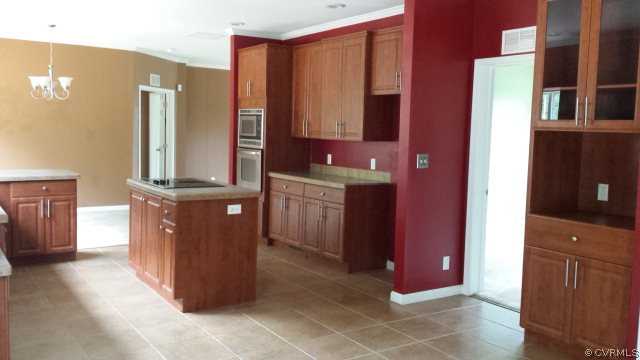 3814 Meherrin Road Meherrin, VA 23954 - Photo 7 of 15 a kitchen with stainless steel appliances granite countertop a refrigerator and a stove