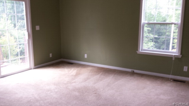 3814 Meherrin Road Meherrin, VA 23954 - Photo 9 of 15 an empty room with windows