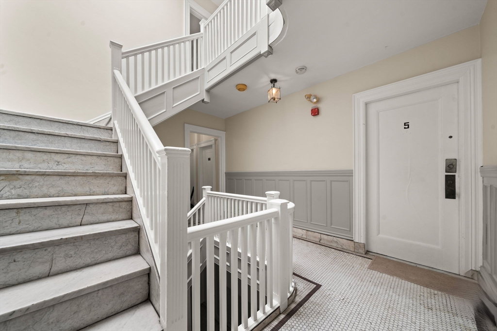 224 Jamaicaway, Unit 5 Boston, MA 02130 - Photo 12 of 15 a view of staircase with white walls and a window