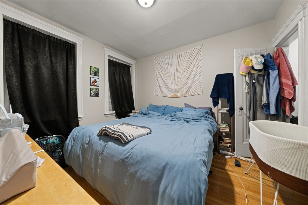 224 Jamaicaway, Unit 5 Boston, MA 02130 - Photo 7 of 15 a bedroom with a bed and walk in closet
