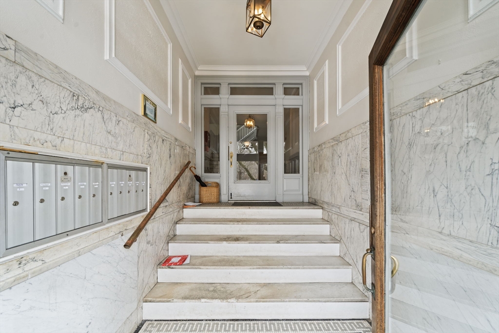 224 Jamaicaway, Unit 5 Boston, MA 02130 - Photo 10 of 15 a view of staircase with white walls and windows