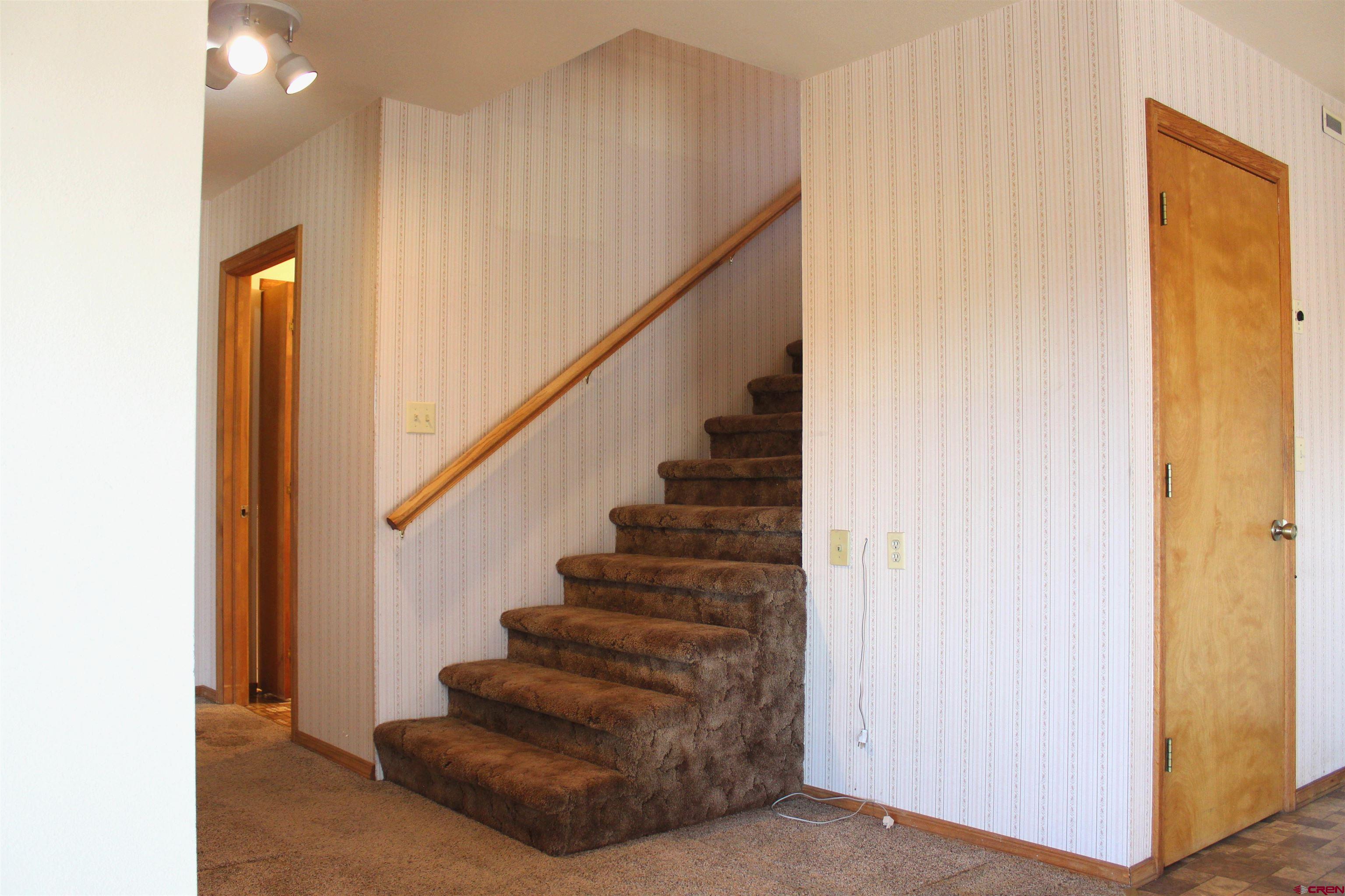 16754 Bull Mesa Road Cedaredge, CO 81413 - Photo 15 of 35 a view of entryway and hall with wooden floor