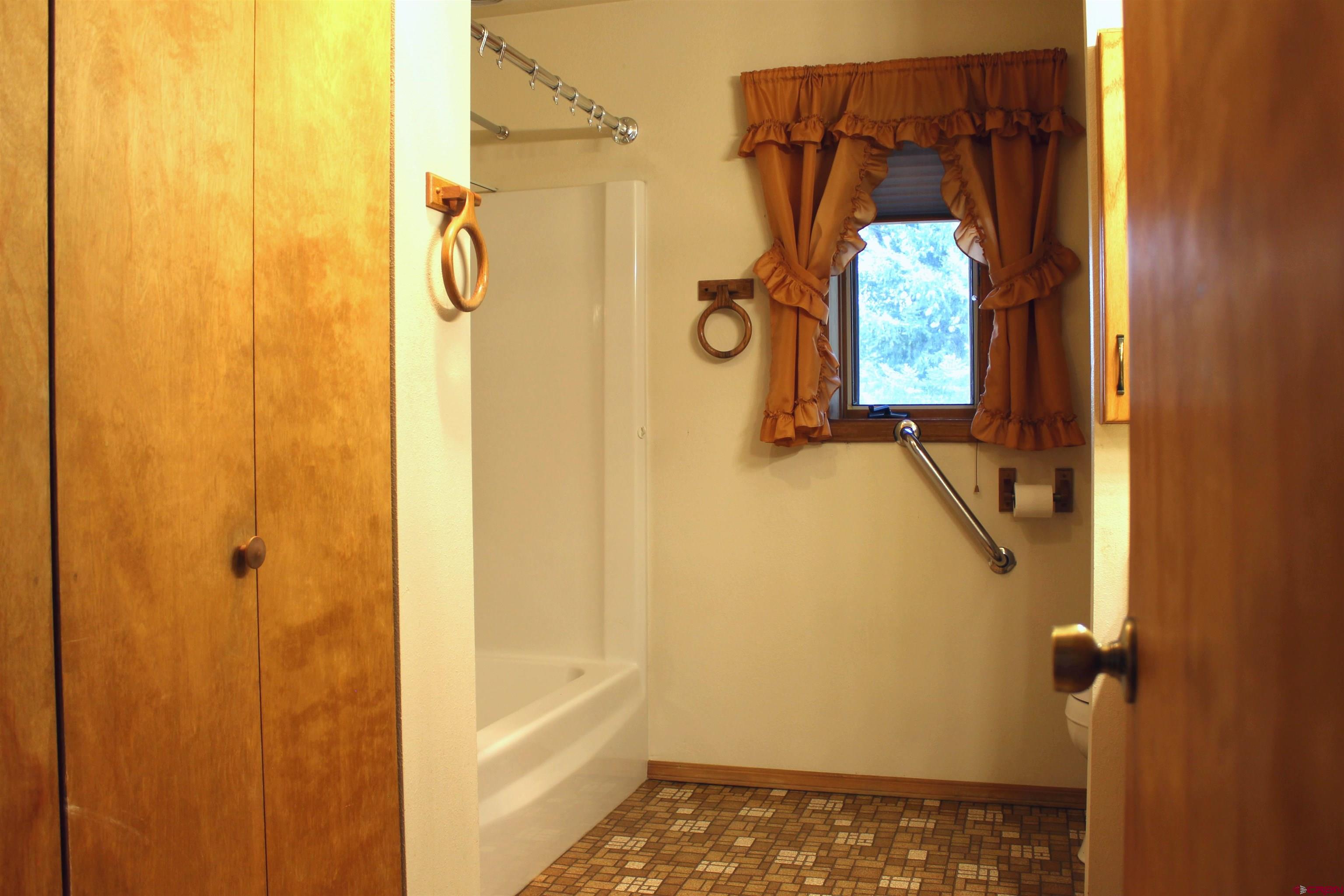 16754 Bull Mesa Road Cedaredge, CO 81413 - Photo 19 of 35 a bathroom with a shower
