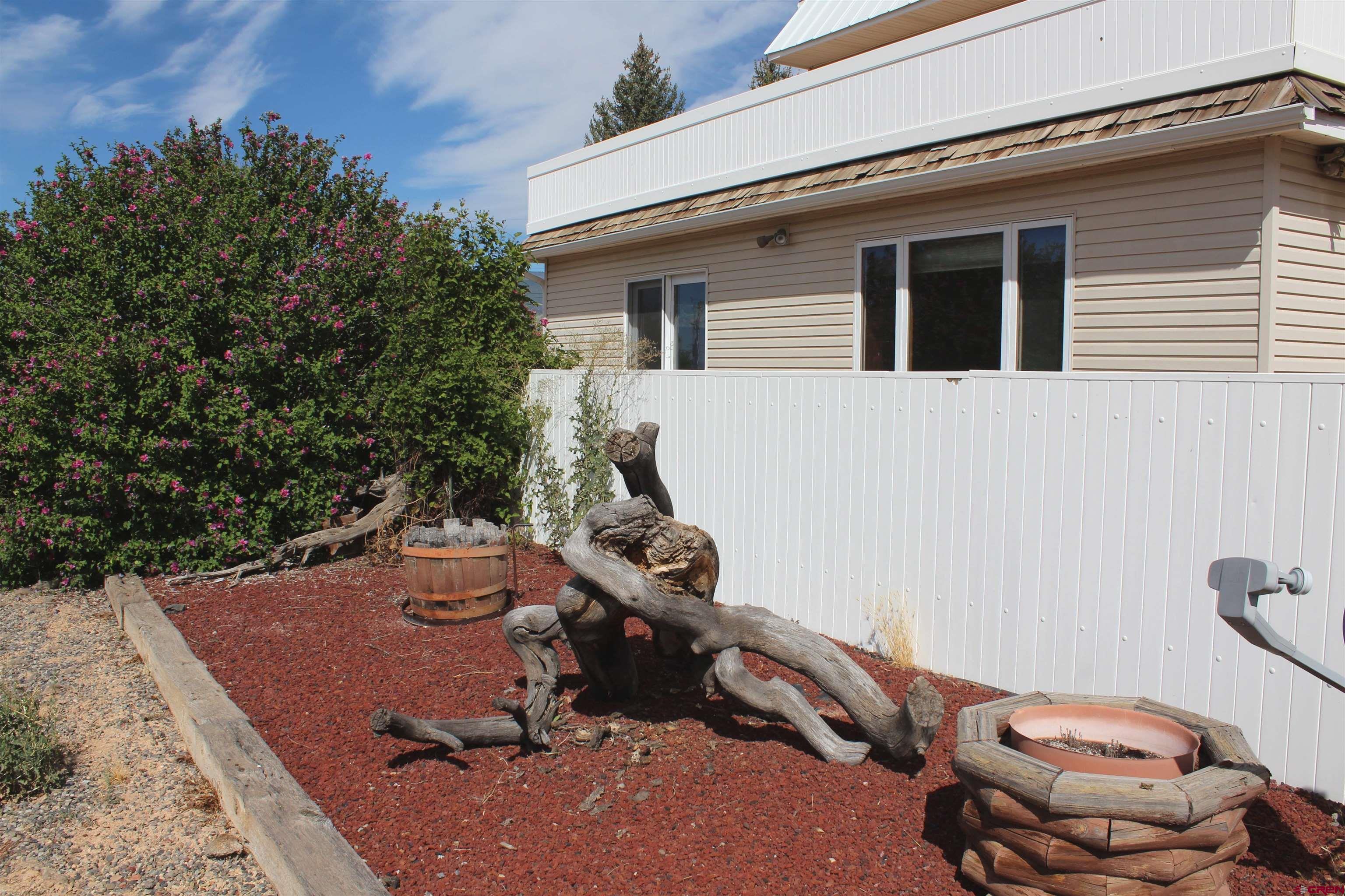 16754 Bull Mesa Road Cedaredge, CO 81413 - Photo 28 of 35 a view of a backyard with chairs