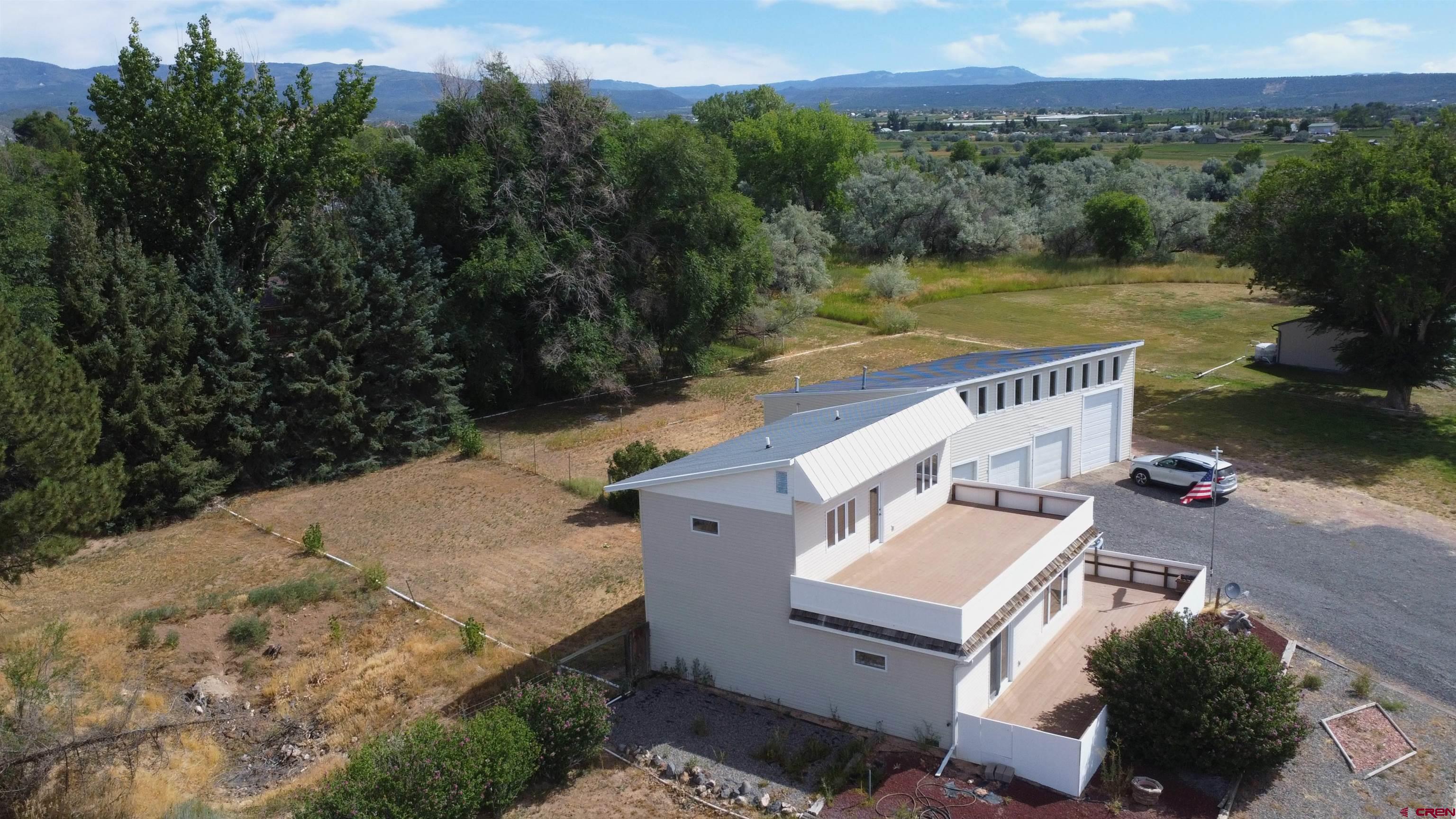 16754 Bull Mesa Road Cedaredge, CO 81413 - Photo 4 of 35 a view of a terrace with a yard