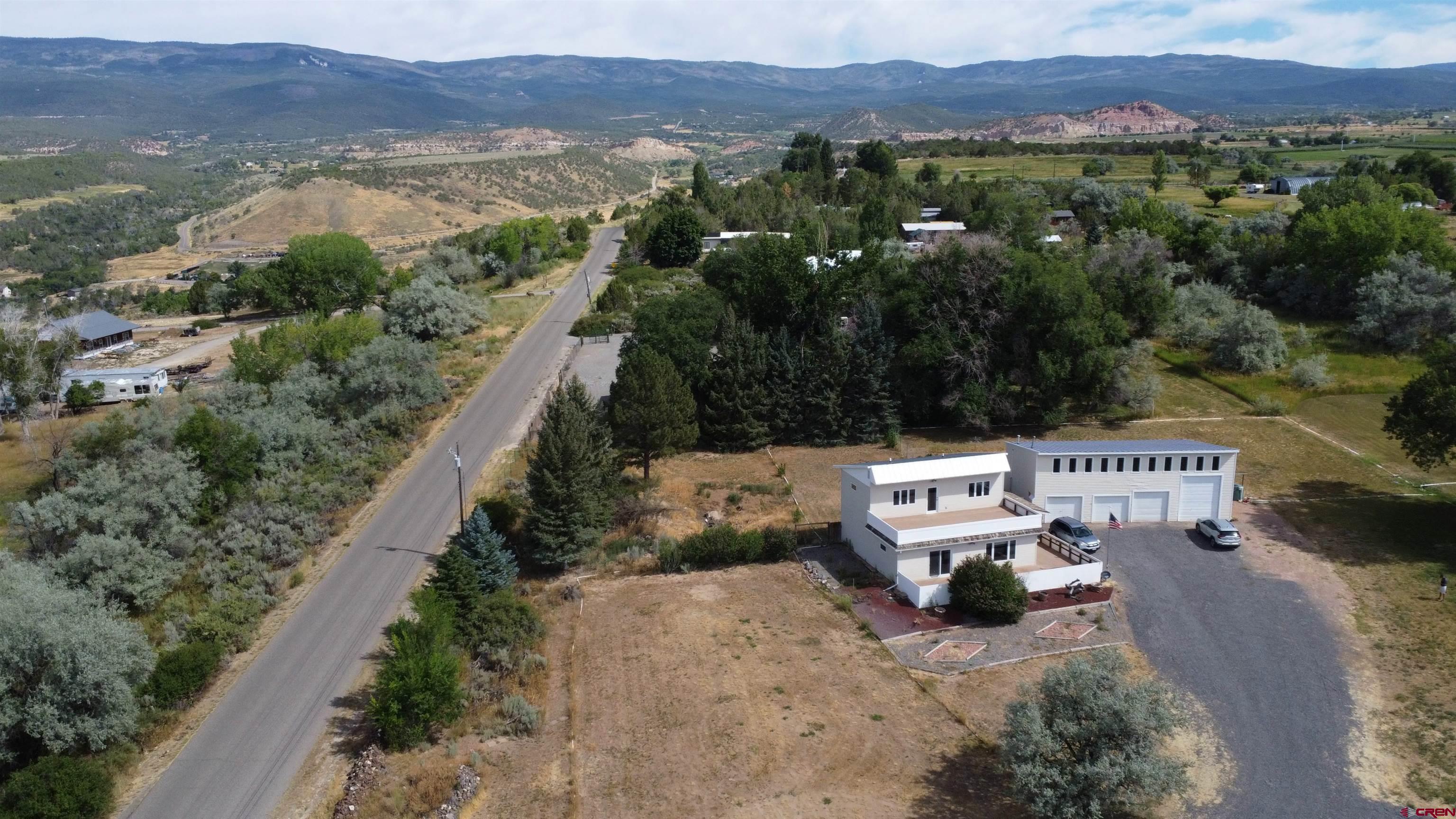 16754 Bull Mesa Road Cedaredge, CO 81413 - Photo 6 of 35 a view of a city with mountain