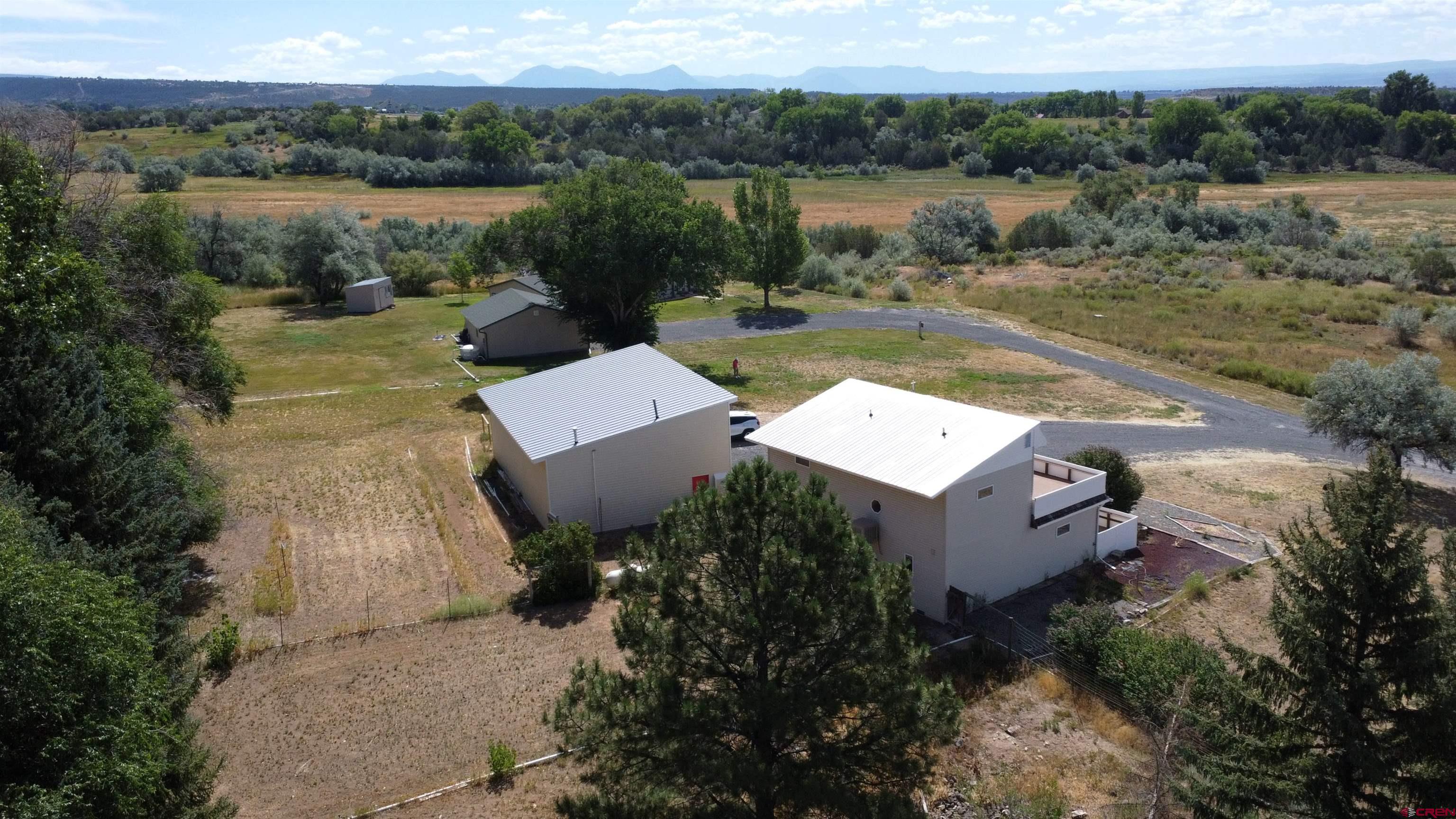 16754 Bull Mesa Road Cedaredge, CO 81413 - Photo 7 of 35 a view of a lake with a mountain in the background