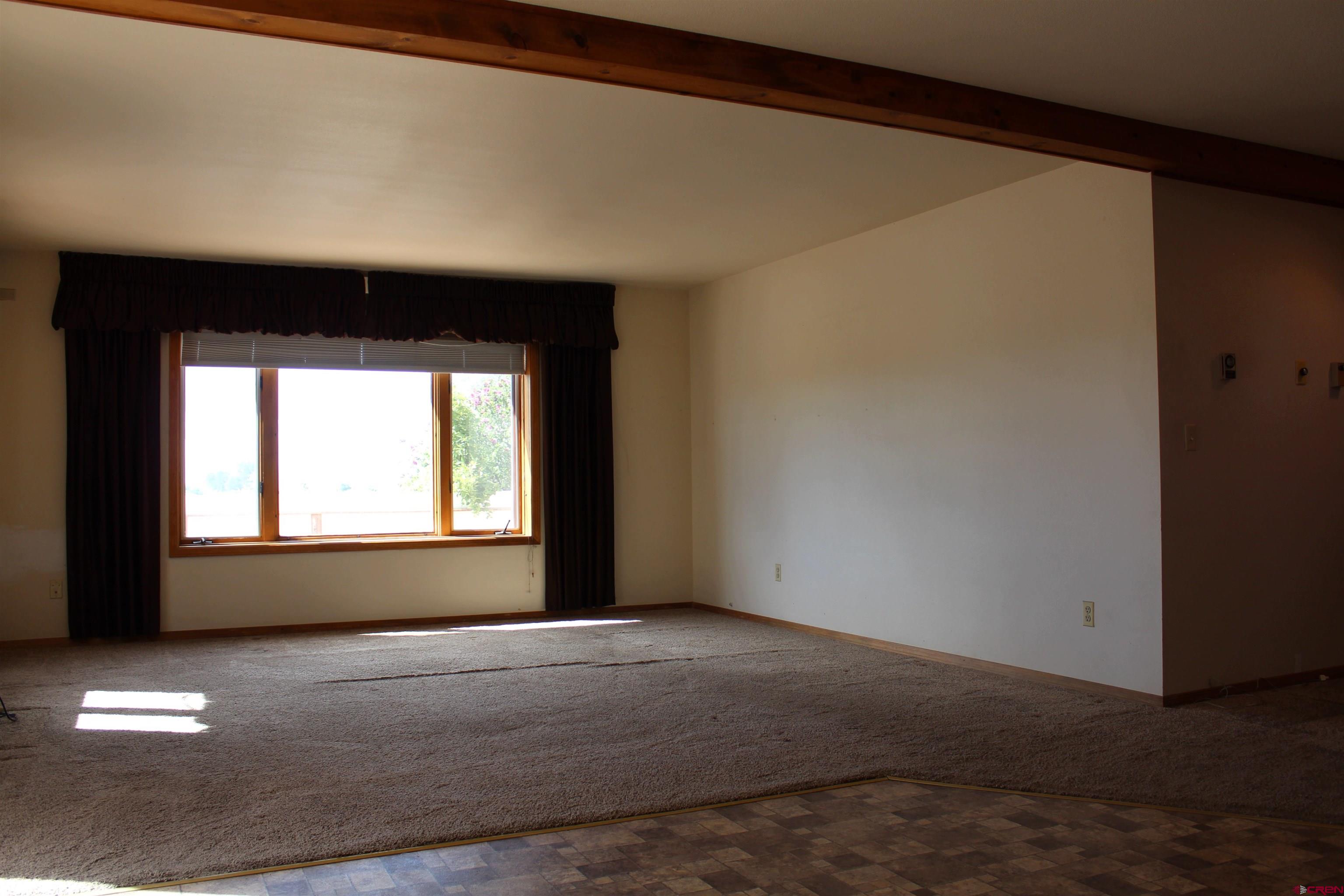 16754 Bull Mesa Road Cedaredge, CO 81413 - Photo 10 of 35 a view of an empty room with a window