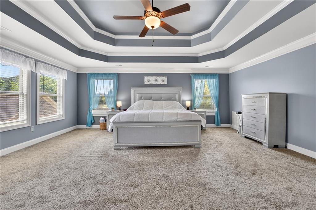 2300 Tucker Mill Road Southwest Conyers, GA 30094 - Photo 21 of 45 a spacious bedroom with a bed and window