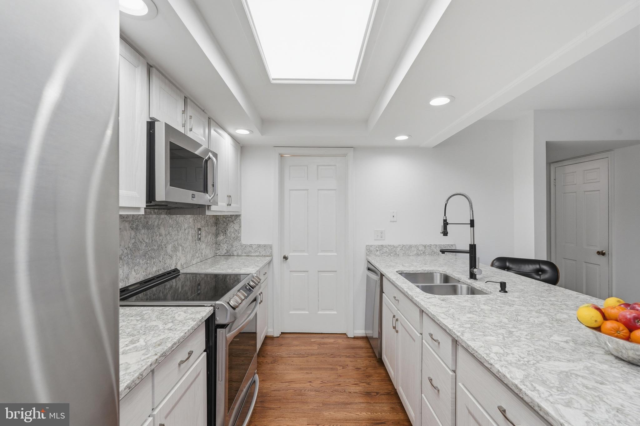 1734 Dana Street Crofton, MD 21114 - Photo 11 of 40 a kitchen with sink a microwave and stove