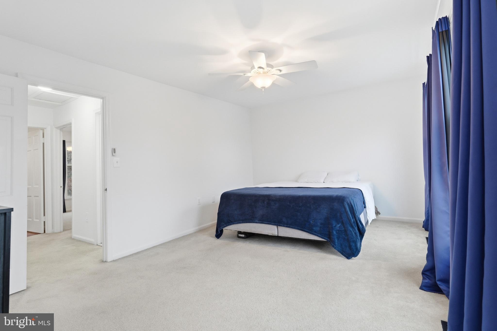 1734 Dana Street Crofton, MD 21114 - Photo 19 of 40 a room with a couch and chandelier