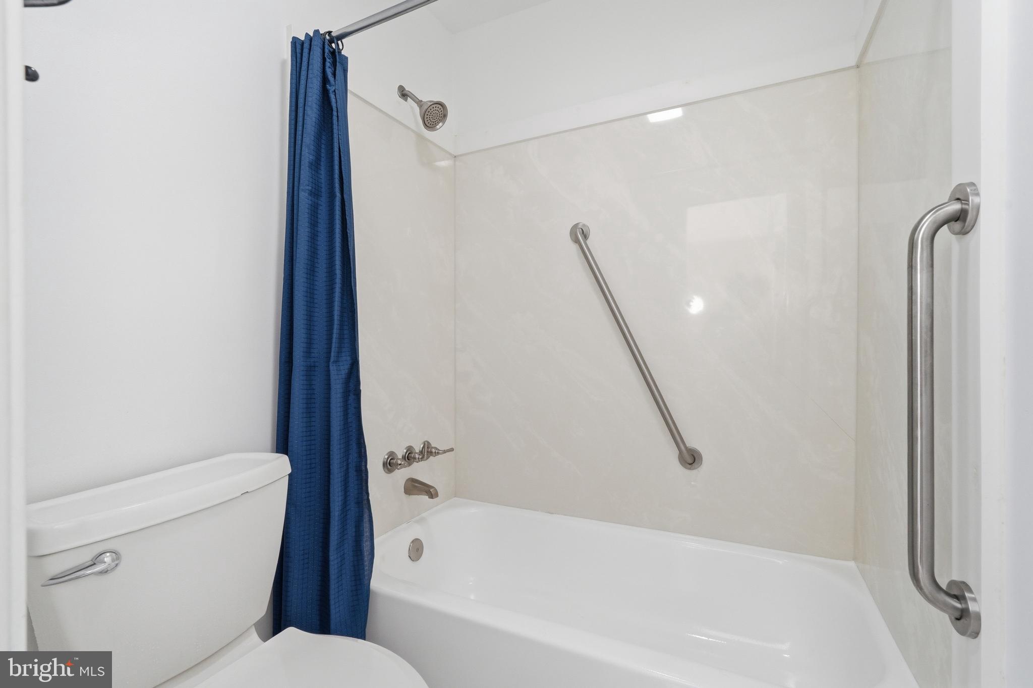 1734 Dana Street Crofton, MD 21114 - Photo 21 of 40 a bathroom with a bathtub and a toilet