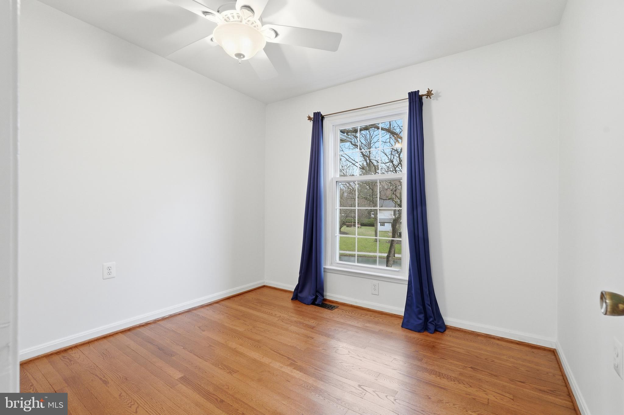 1734 Dana Street Crofton, MD 21114 - Photo 24 of 40 an empty room with wooden floor and windows