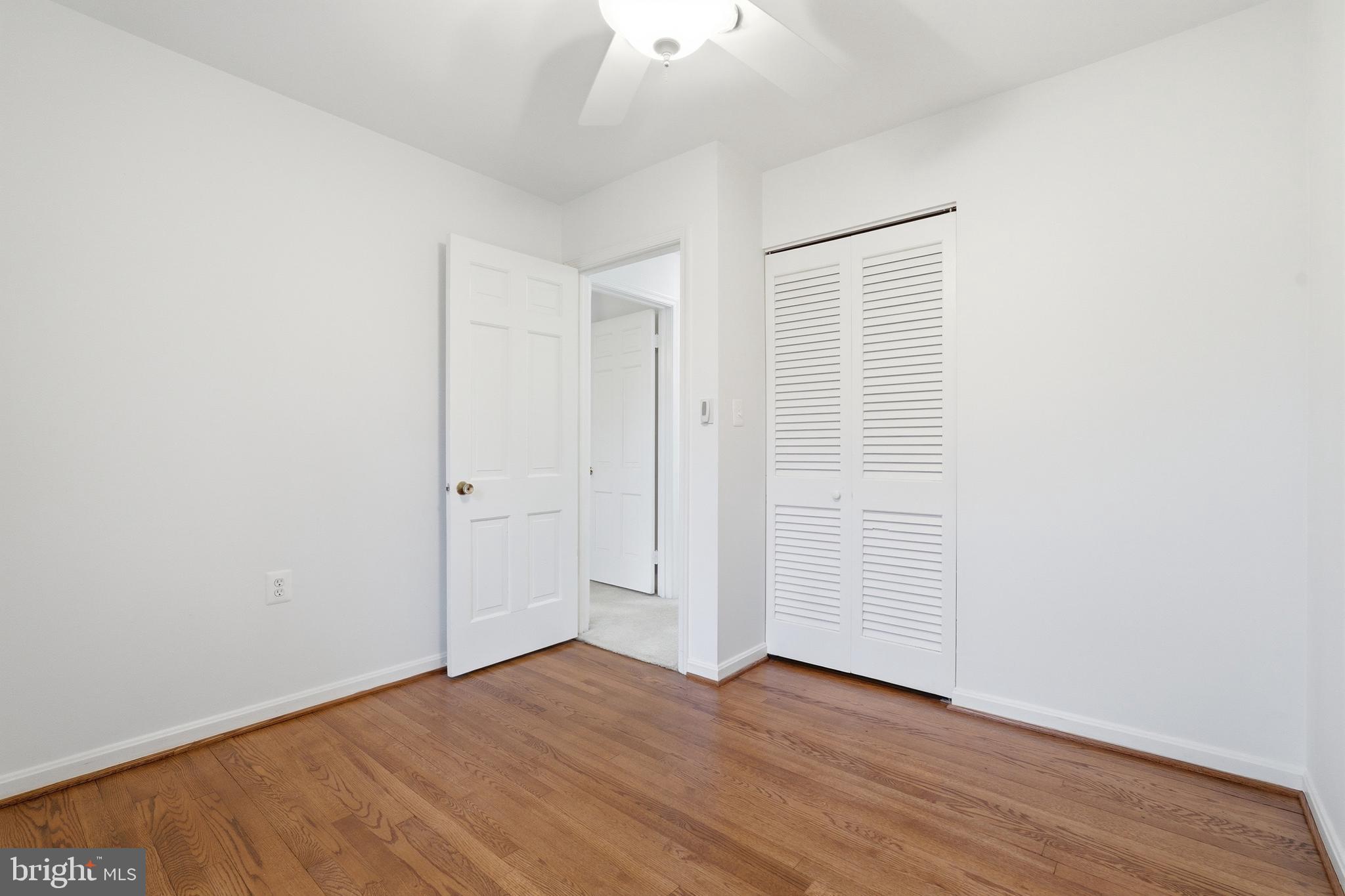 1734 Dana Street Crofton, MD 21114 - Photo 25 of 40 an empty room with wooden floor and windows