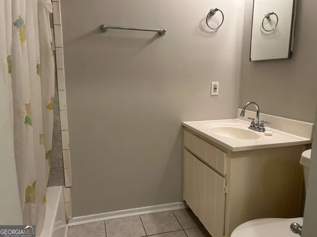 a bathroom with a sink toilet and vanity
