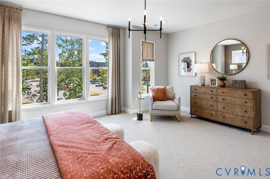16120 Esteem Way Midlothian, VA 23113 - Photo 18 of 38 a spacious bedroom with a bed a dresser and a large window