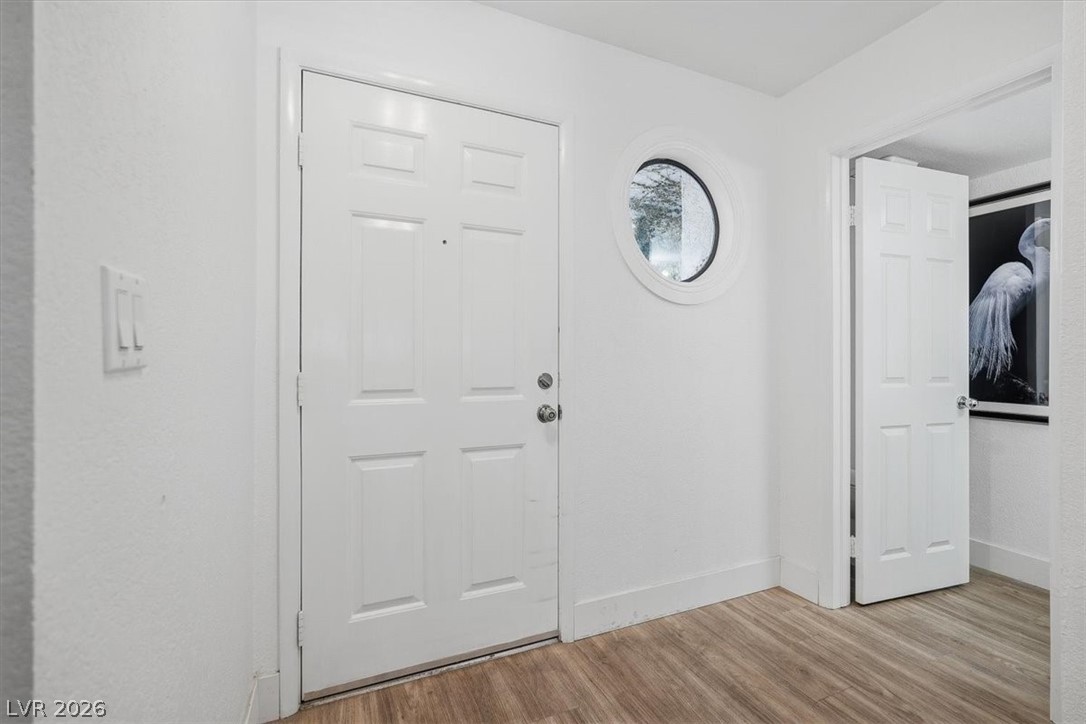 6250 West Flamingo Road, Unit 93 Las Vegas, NV 89103 - Photo 8 of 38 This entry welcomes with clean lines and durable flooring.