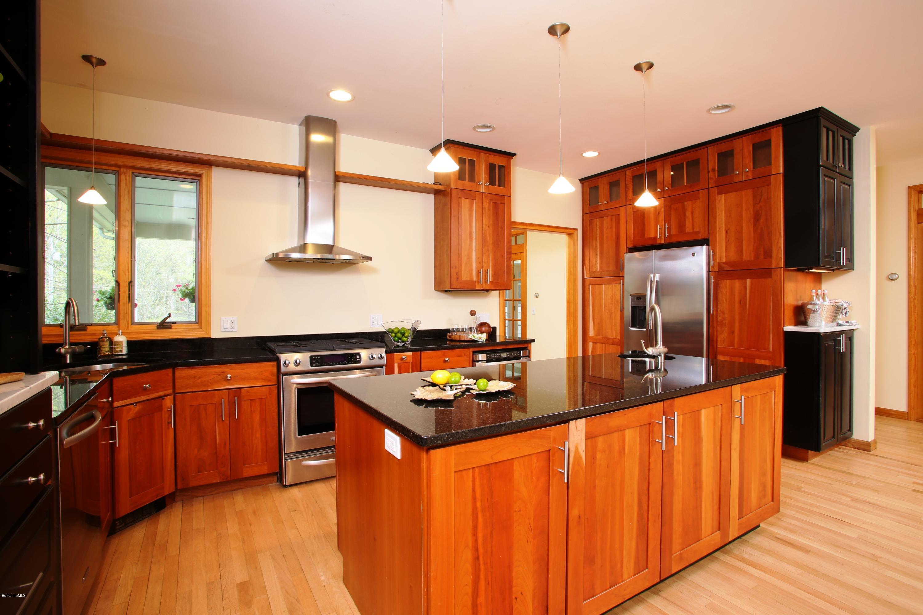 35 Under Mountain Road Lenox, MA 01240 - Photo 8 of 25 a kitchen with stainless steel appliances a sink stove and wooden floor