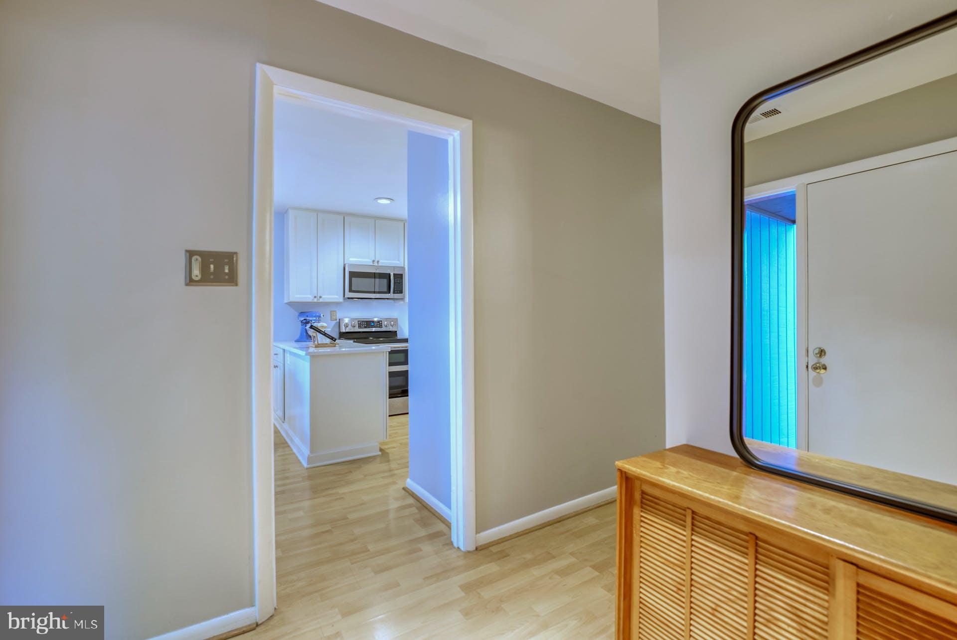 2023 Approach Lane Reston, VA 20191 - Photo 4 of 30 A peek into the Kitchen From the Foyer