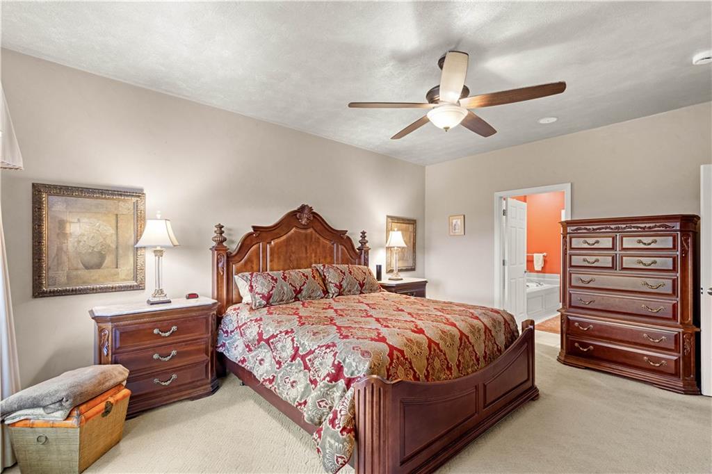 2408 Hilltop Road Presto, PA 15142 - Photo 17 of 42 a bedroom with a bed and a chandelier