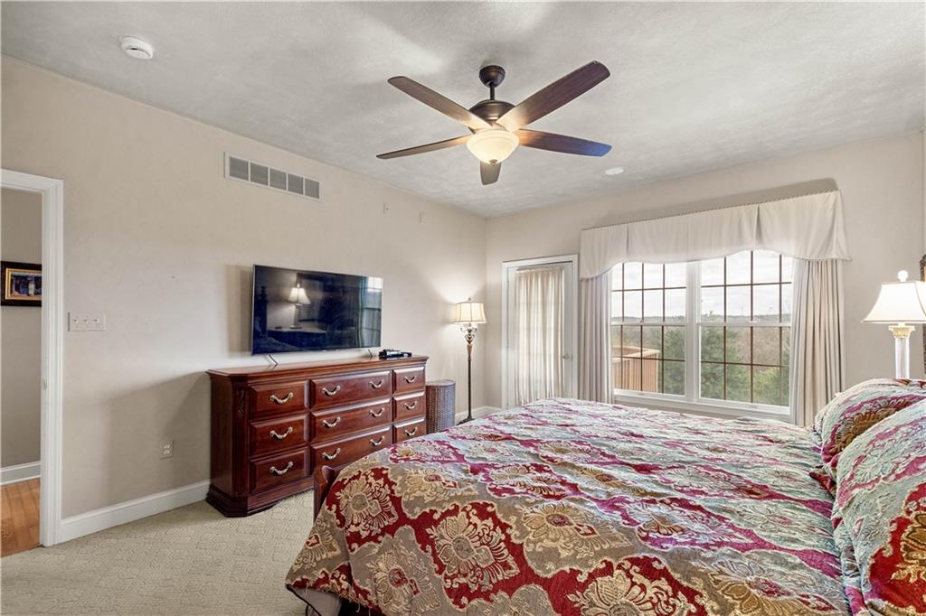 2408 Hilltop Road Presto, PA 15142 - Photo 18 of 42 a bedroom with a bed and a flat screen tv