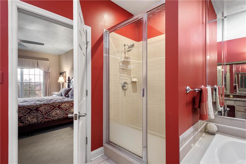 2408 Hilltop Road Presto, PA 15142 - Photo 20 of 42 a bedroom with a bed and a mirror