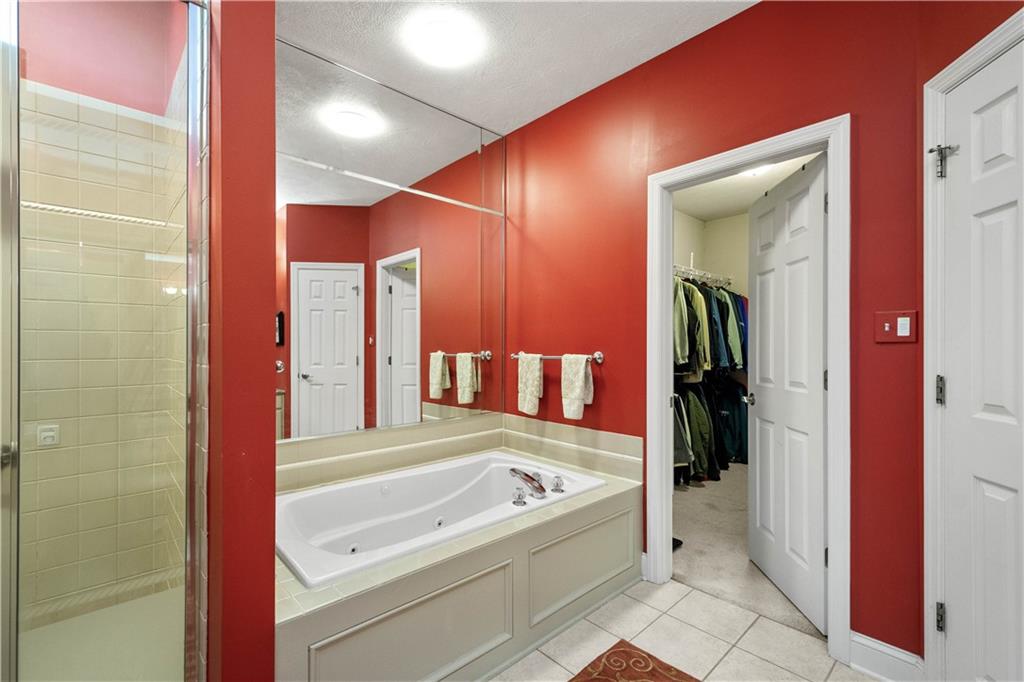 2408 Hilltop Road Presto, PA 15142 - Photo 21 of 42 a bathroom with a bathtub and a shower