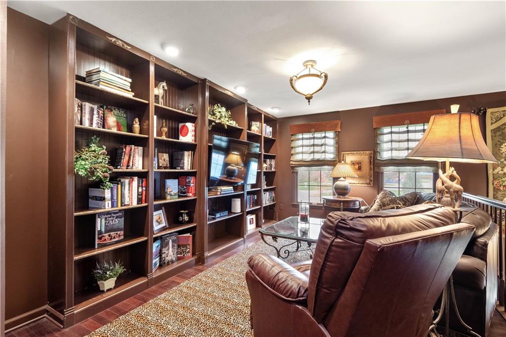 2408 Hilltop Road Presto, PA 15142 - Photo 26 of 42 a room with furniture and a book shelf