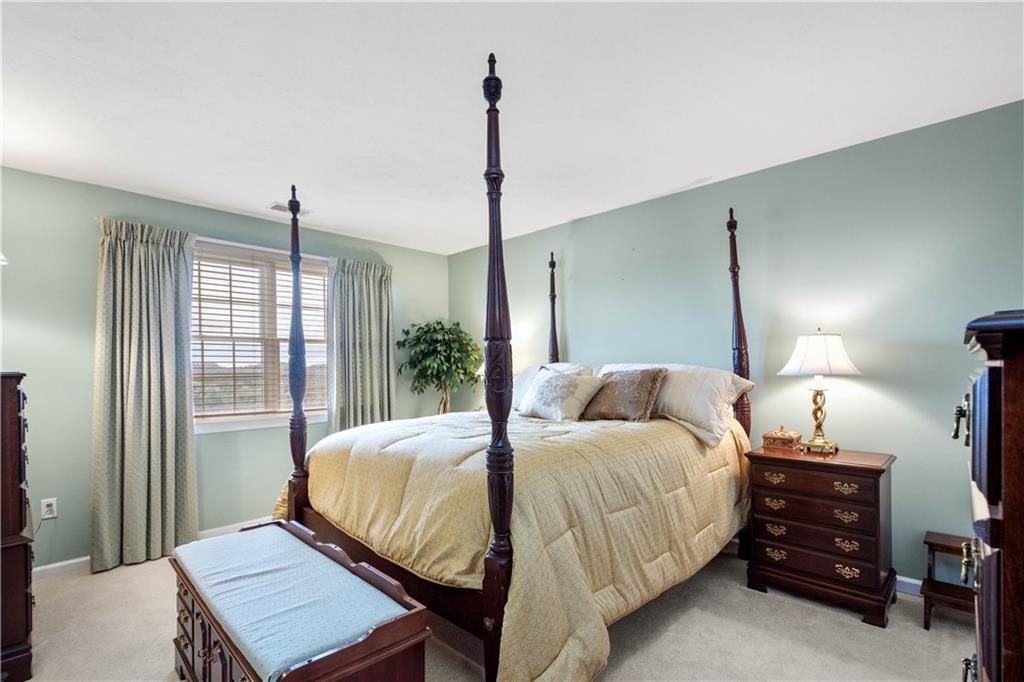 2408 Hilltop Road Presto, PA 15142 - Photo 29 of 42 a bedroom with a bed and a dresser next to a window
