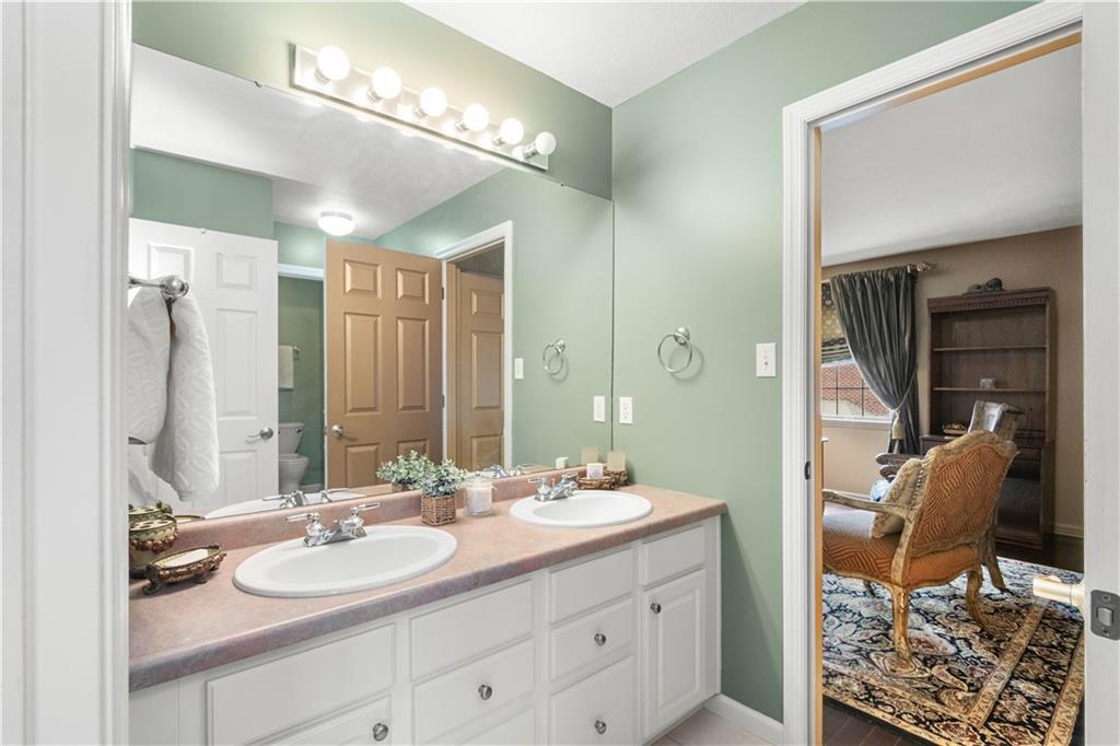 2408 Hilltop Road Presto, PA 15142 - Photo 31 of 42 a bathroom with a double vanity sink and a mirror