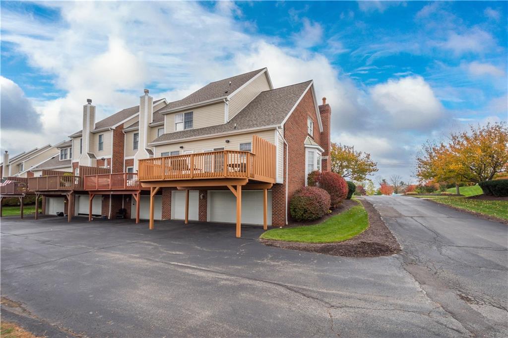 2408 Hilltop Road Presto, PA 15142 - Photo 38 of 42 a view of a big house with many windows and a yard