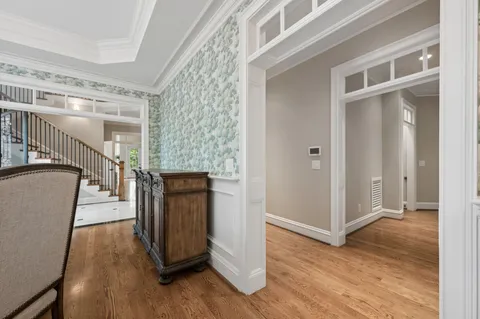 a spacious bedroom with a bed and a fireplace