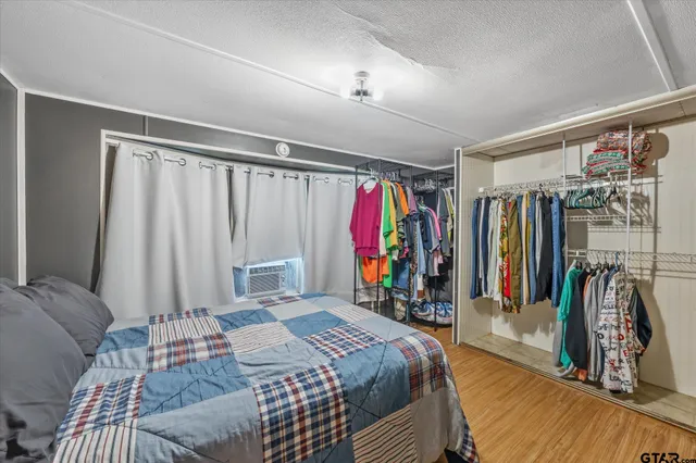 a bed room with a bed and a walk in closet