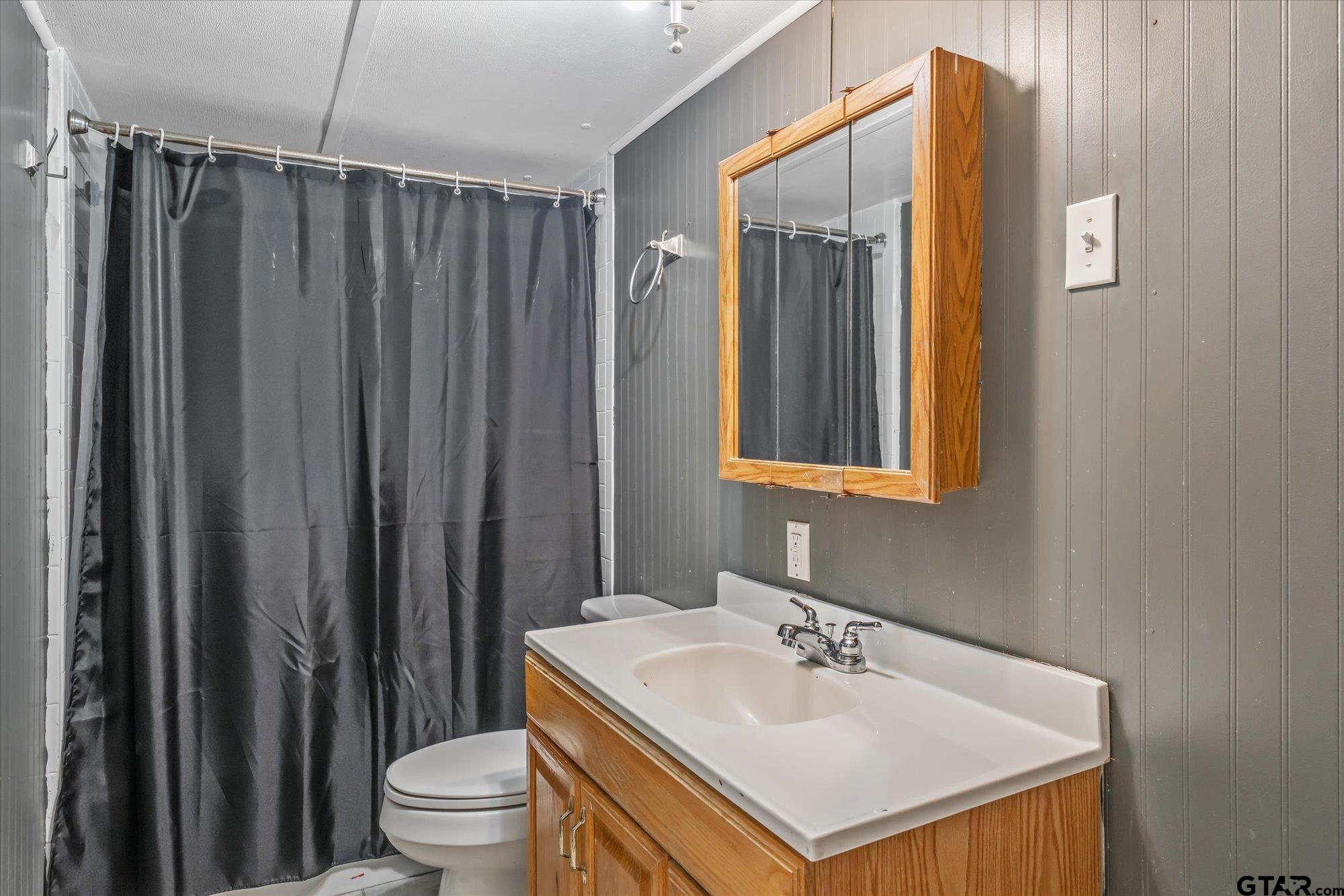 338 Bandera Bullard, TX 75757 - Photo 16 of 26 a bathroom with a sink toilet and shower