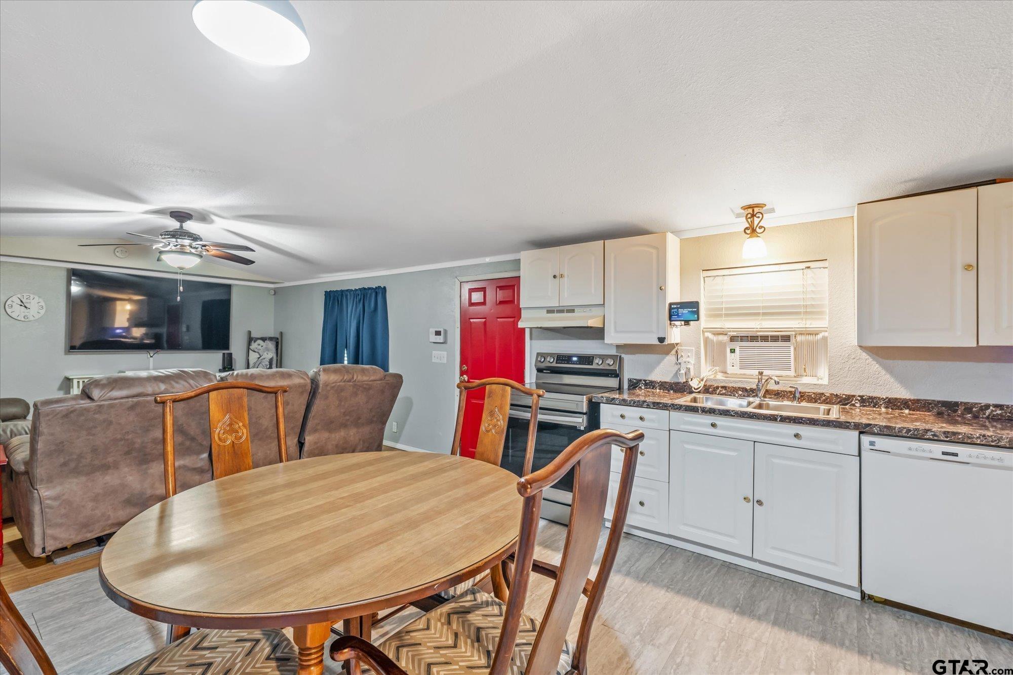 338 Bandera Bullard, TX 75757 - Photo 9 of 26 a living room with stainless steel appliances kitchen island granite countertop furniture and a kitchen view