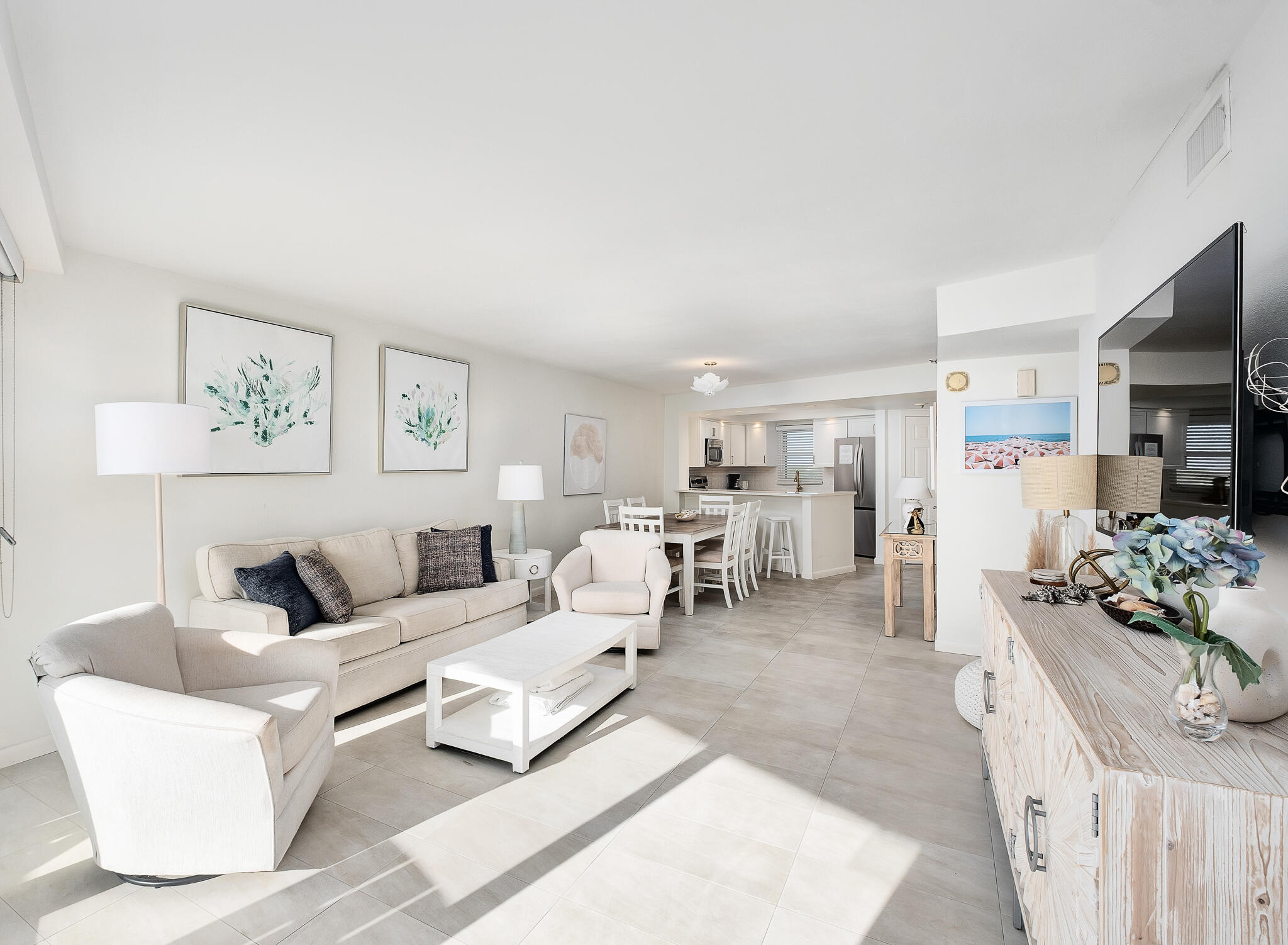 4291 Beachside 2, Unit 4291 Miramar Beach, FL 32550 - Photo 11 of 55 a living room with furniture and a flat screen tv