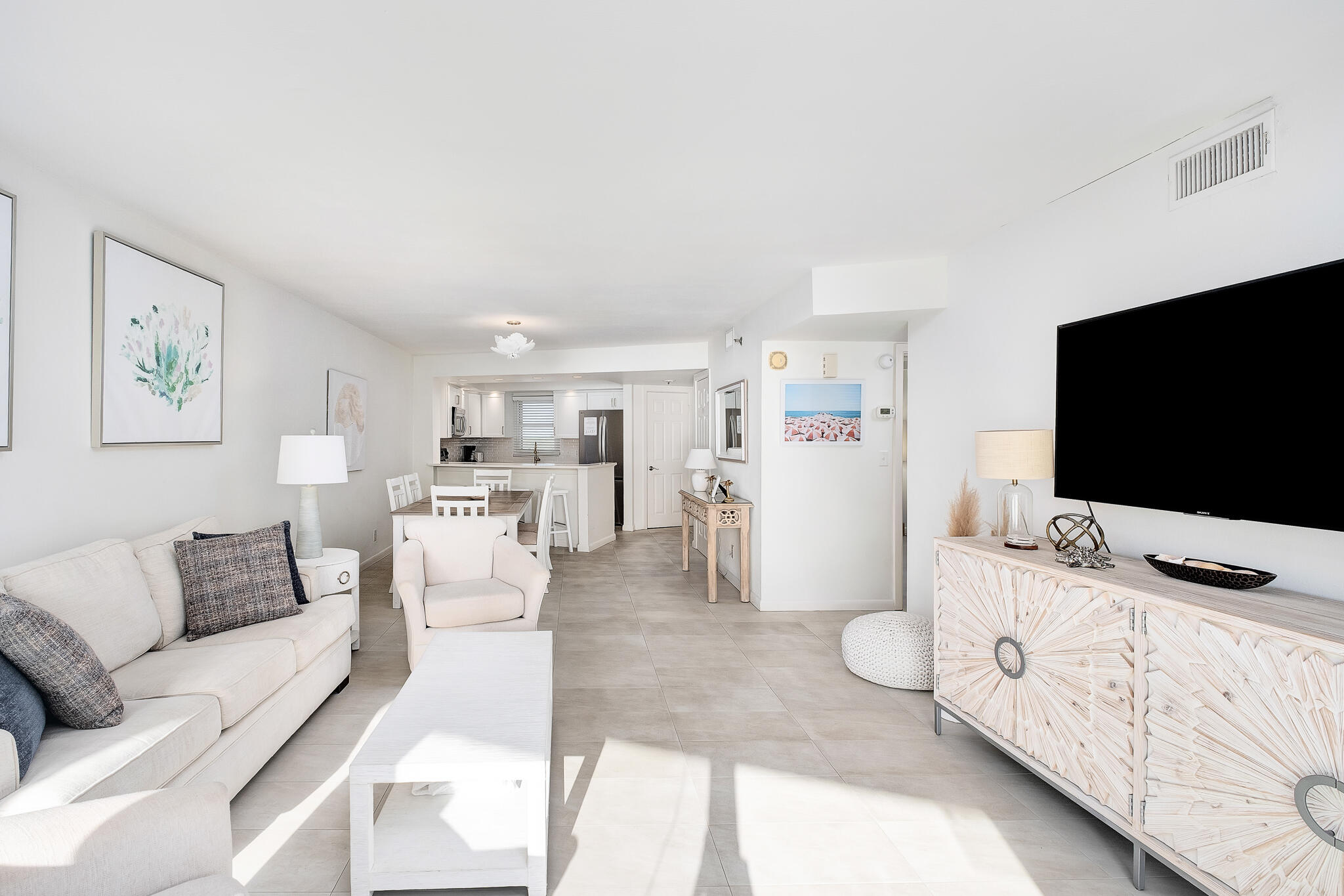 4291 Beachside 2, Unit 4291 Miramar Beach, FL 32550 - Photo 12 of 55 a living room with furniture and a flat screen tv