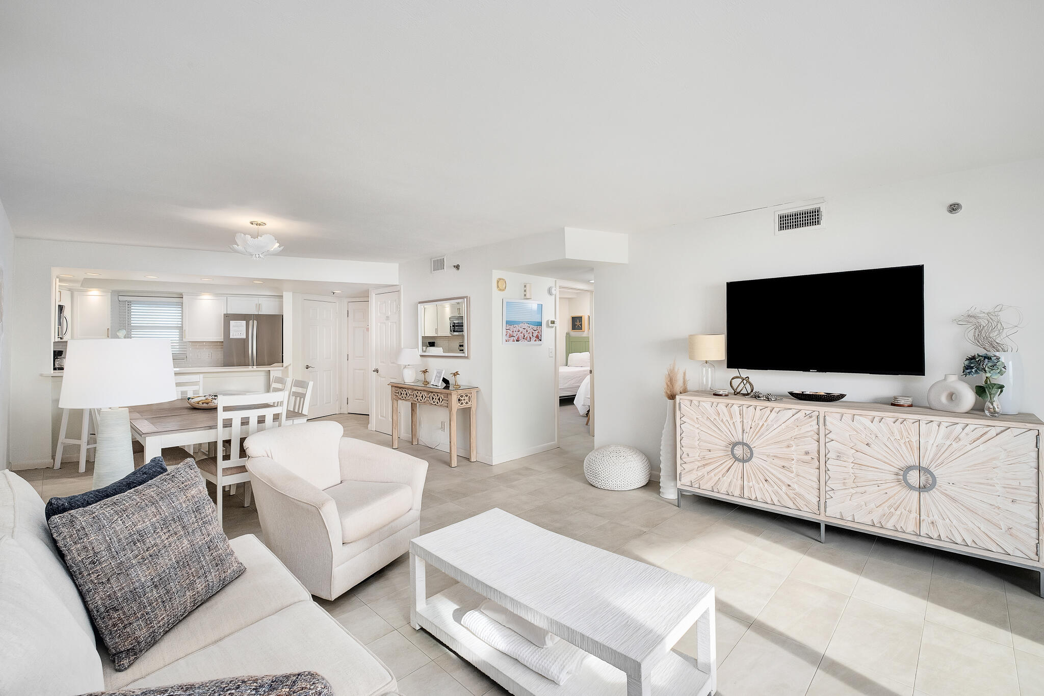 4291 Beachside 2, Unit 4291 Miramar Beach, FL 32550 - Photo 13 of 55 a living room with furniture and a flat screen tv