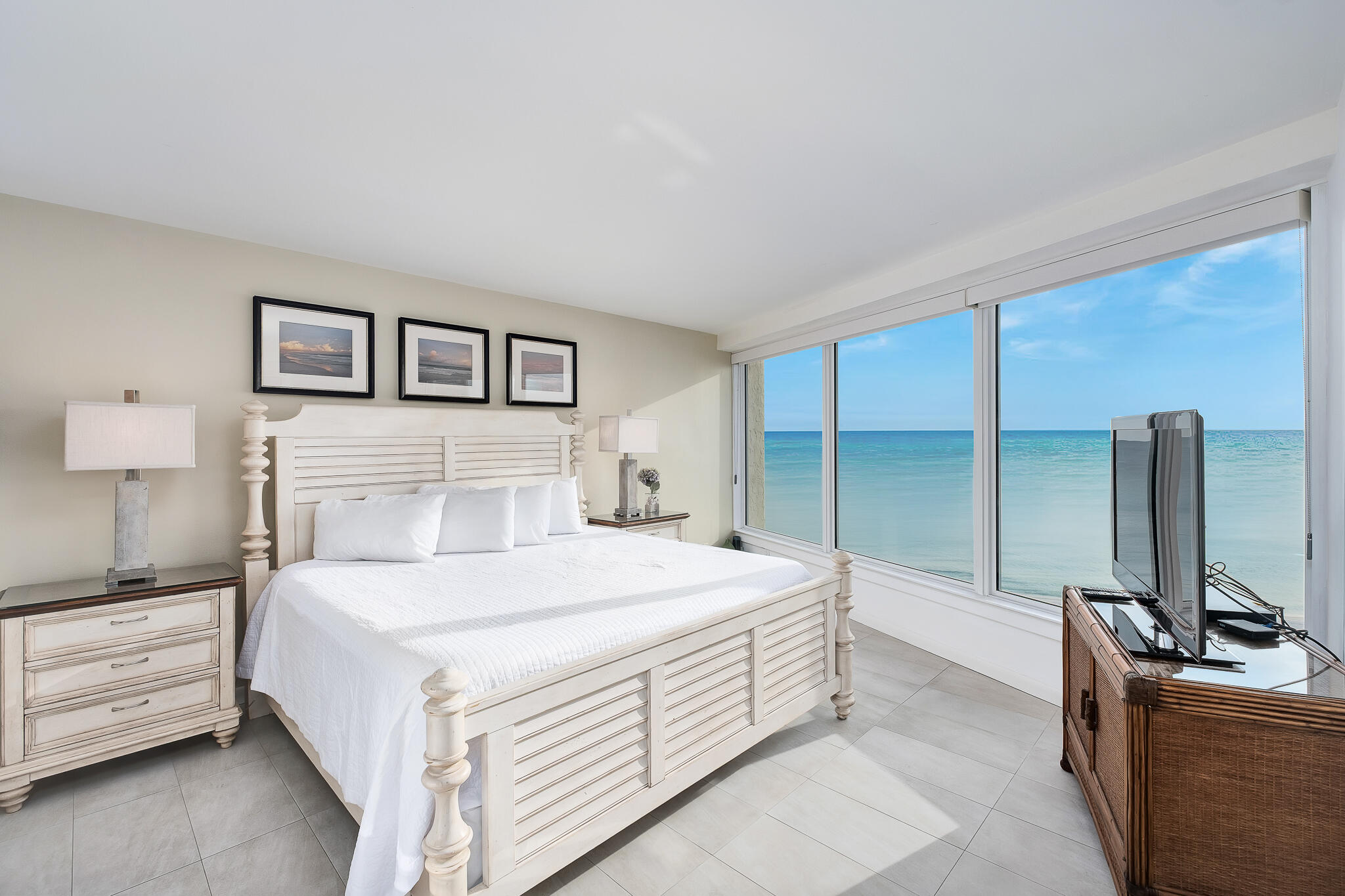 4291 Beachside 2, Unit 4291 Miramar Beach, FL 32550 - Photo 14 of 55 a bedroom with a bed and a flat screen tv