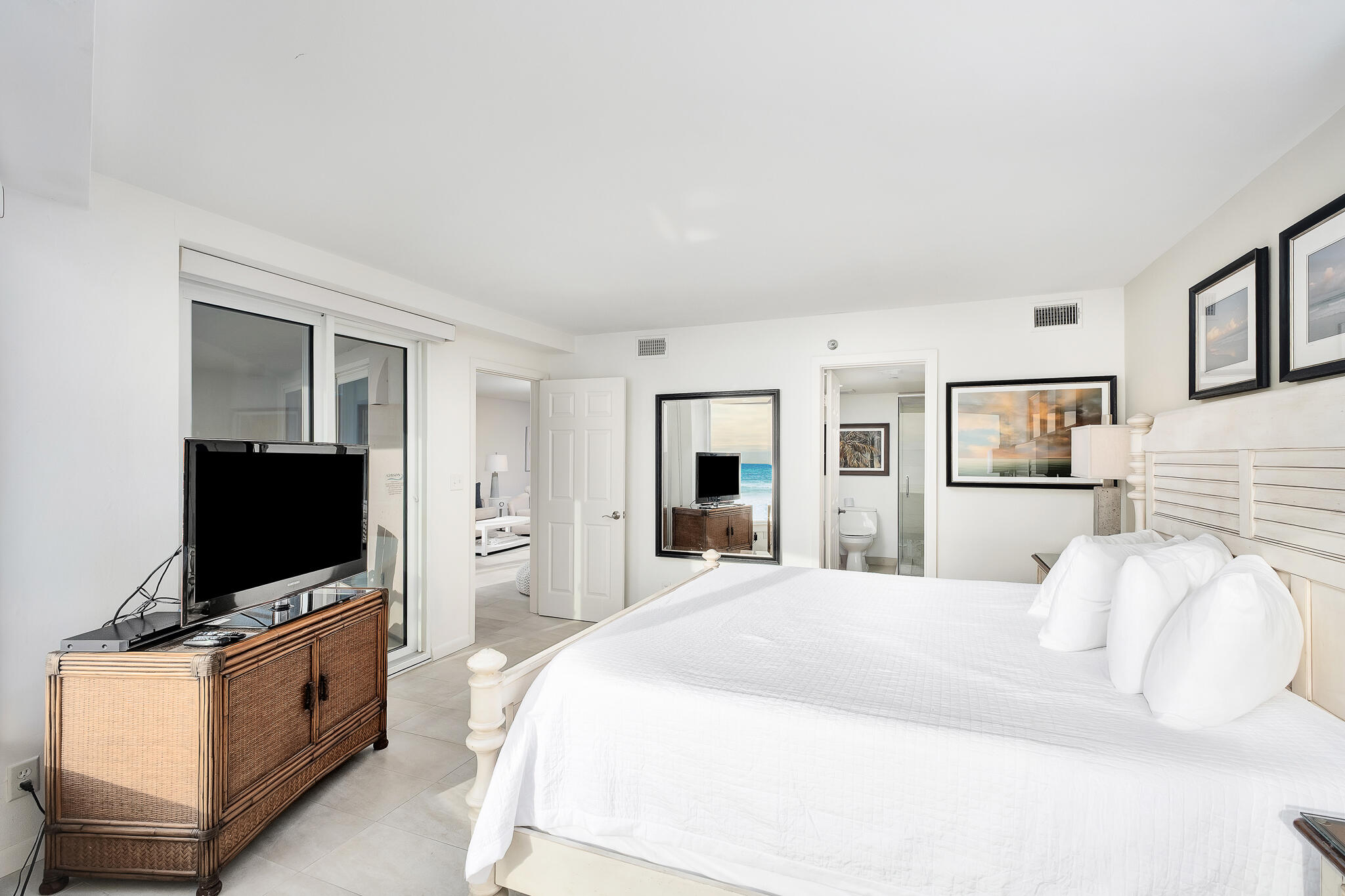 4291 Beachside 2, Unit 4291 Miramar Beach, FL 32550 - Photo 15 of 55 a bedroom with a bed and a flat screen tv