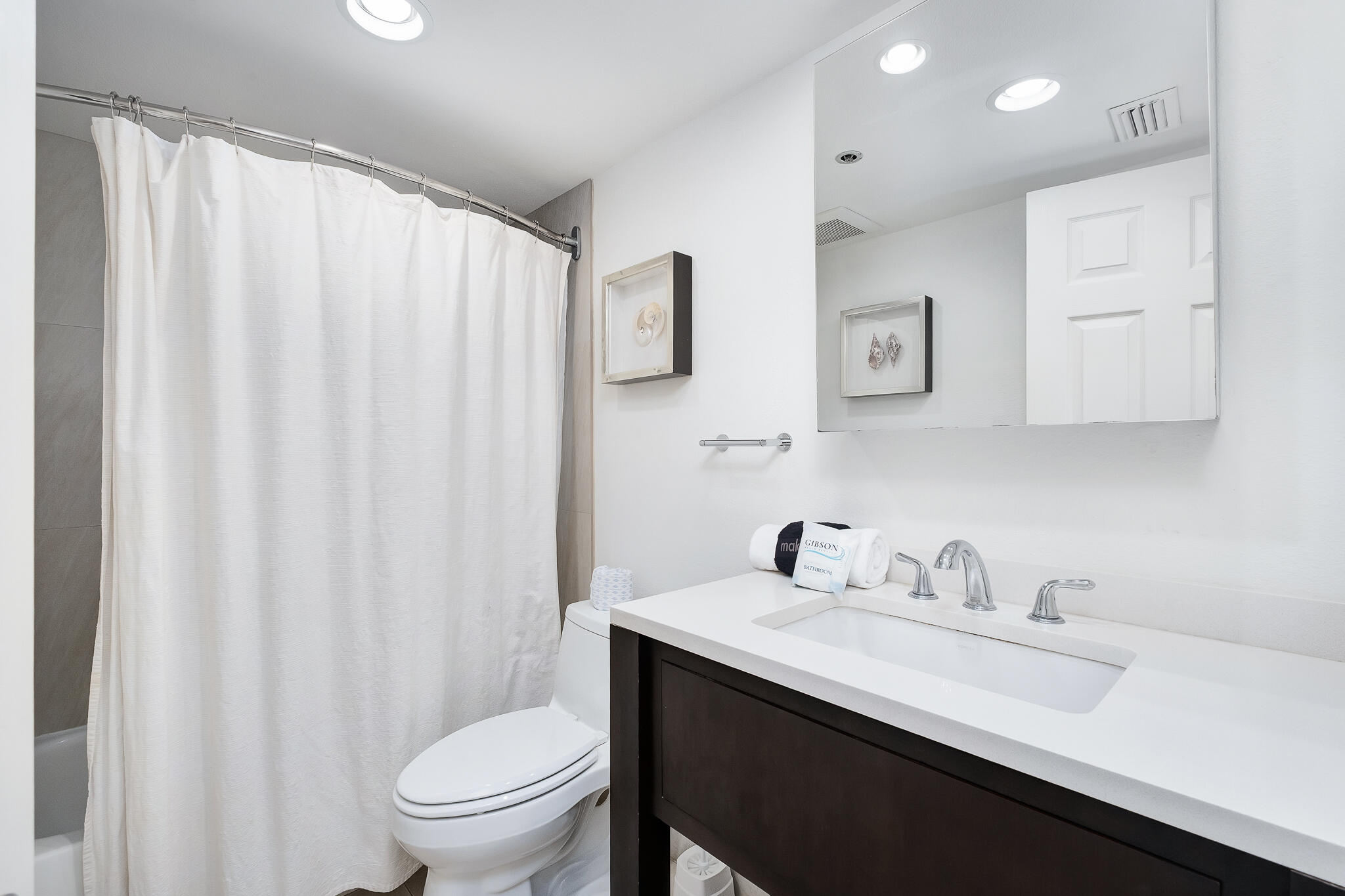 4291 Beachside 2, Unit 4291 Miramar Beach, FL 32550 - Photo 20 of 55 a bathroom with a sink a toilet and shower curtain
