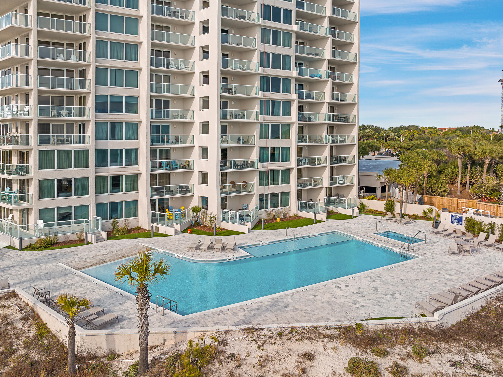 4291 Beachside 2, Unit 4291 Miramar Beach, FL 32550 - Photo 33 of 55 a view of a swimming pool with a lounge chairs
