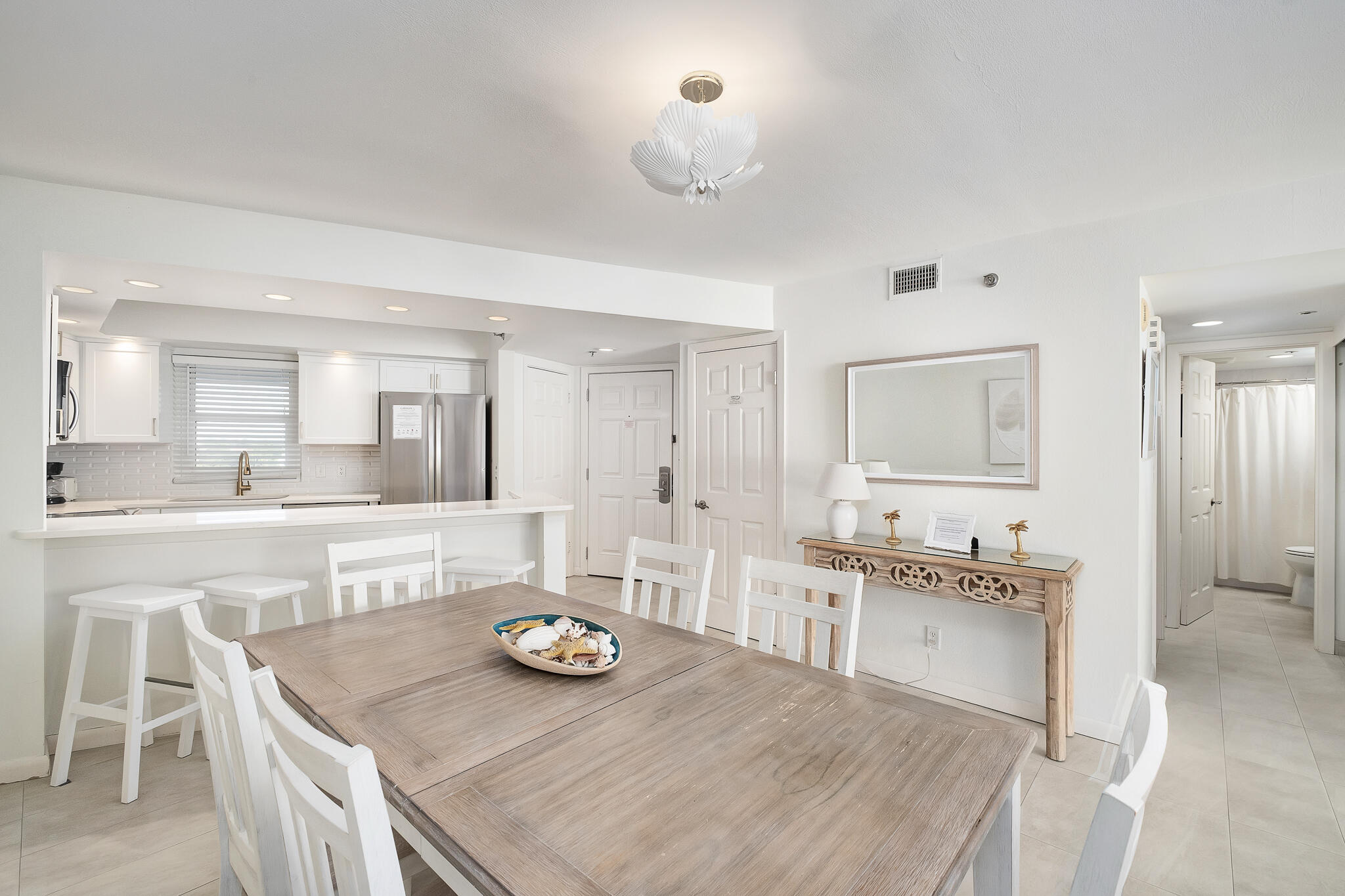 4291 Beachside 2, Unit 4291 Miramar Beach, FL 32550 - Photo 8 of 55 a large kitchen with kitchen island a sink and stove