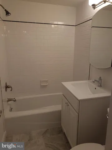a bathroom with a sink and a bathtub