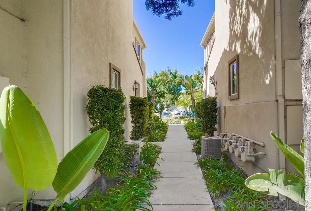1298 Fools Gold Way, Unit 4 Chula Vista, CA 91913 - Photo 3 of 38 a view of a backyard with potted plants