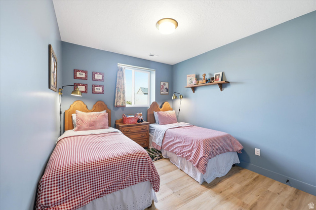 283 North 500 West Mapleton, UT 84664 - Photo 76 of 102 Bedroom featuring light wood-style floors and baseboards.
