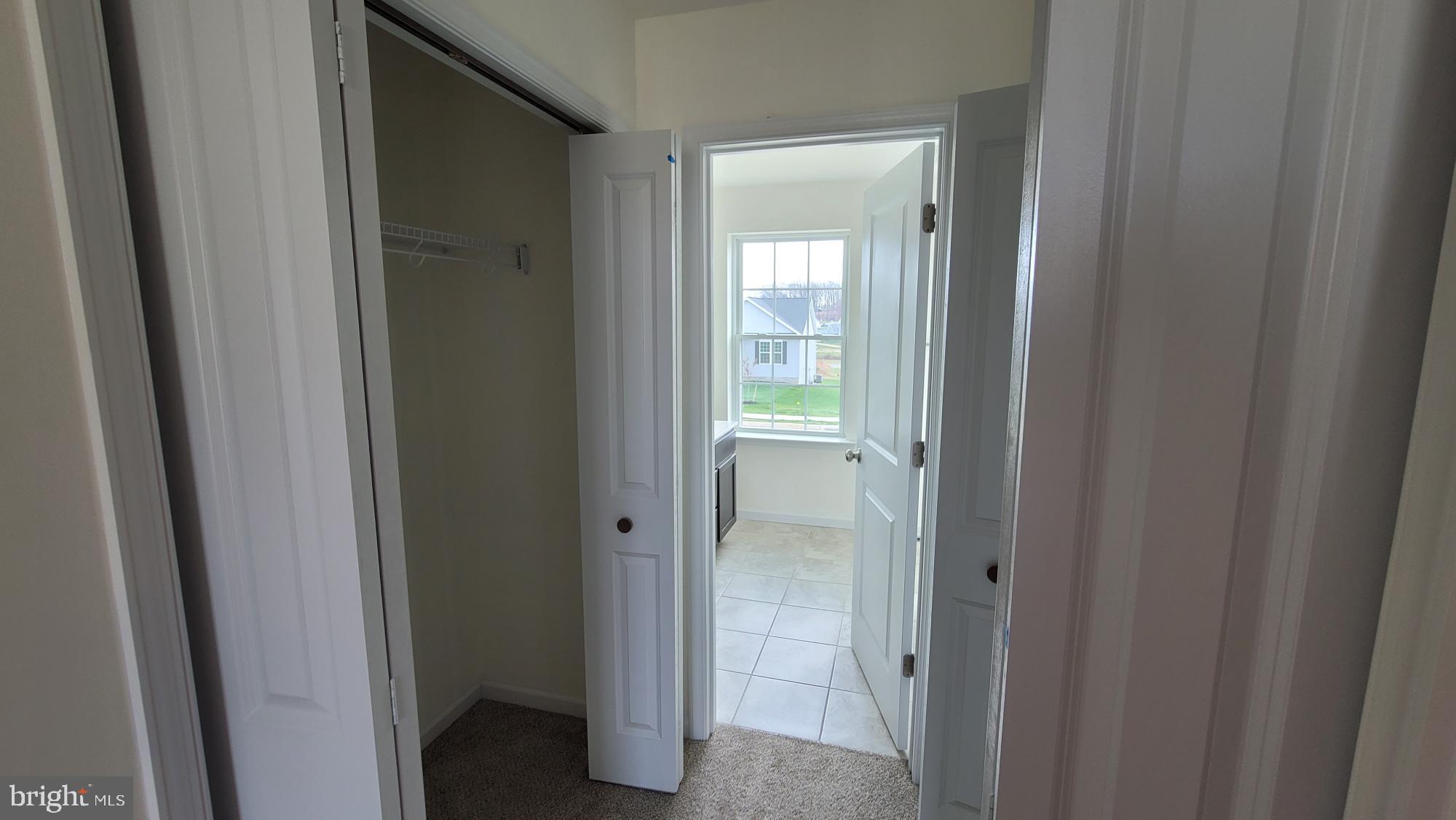 105 Piedmont Way, Unit 104 Hanover, PA 17331 - Photo 16 of 22 a view of a bathroom with a glass door