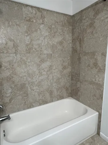 a bathroom with a bathtub